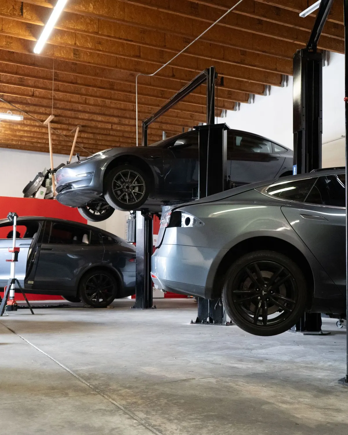 Teslas up on the lifts in our Stanton shop