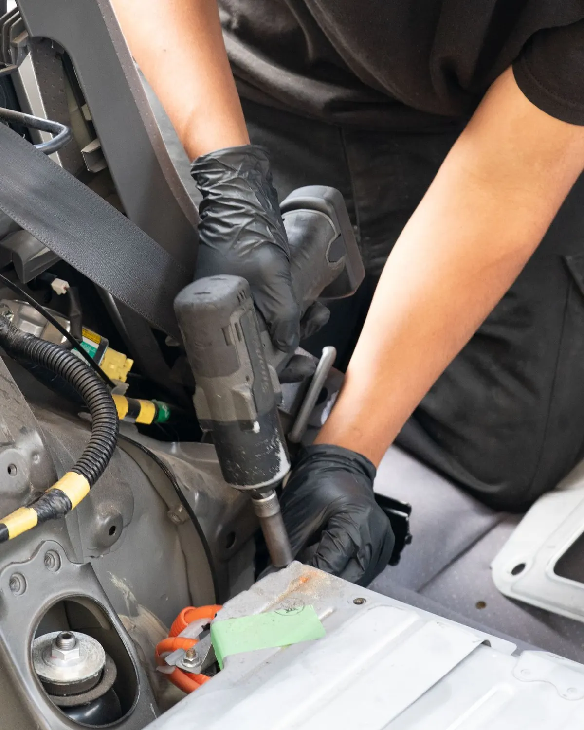 Technician working on a Tesla